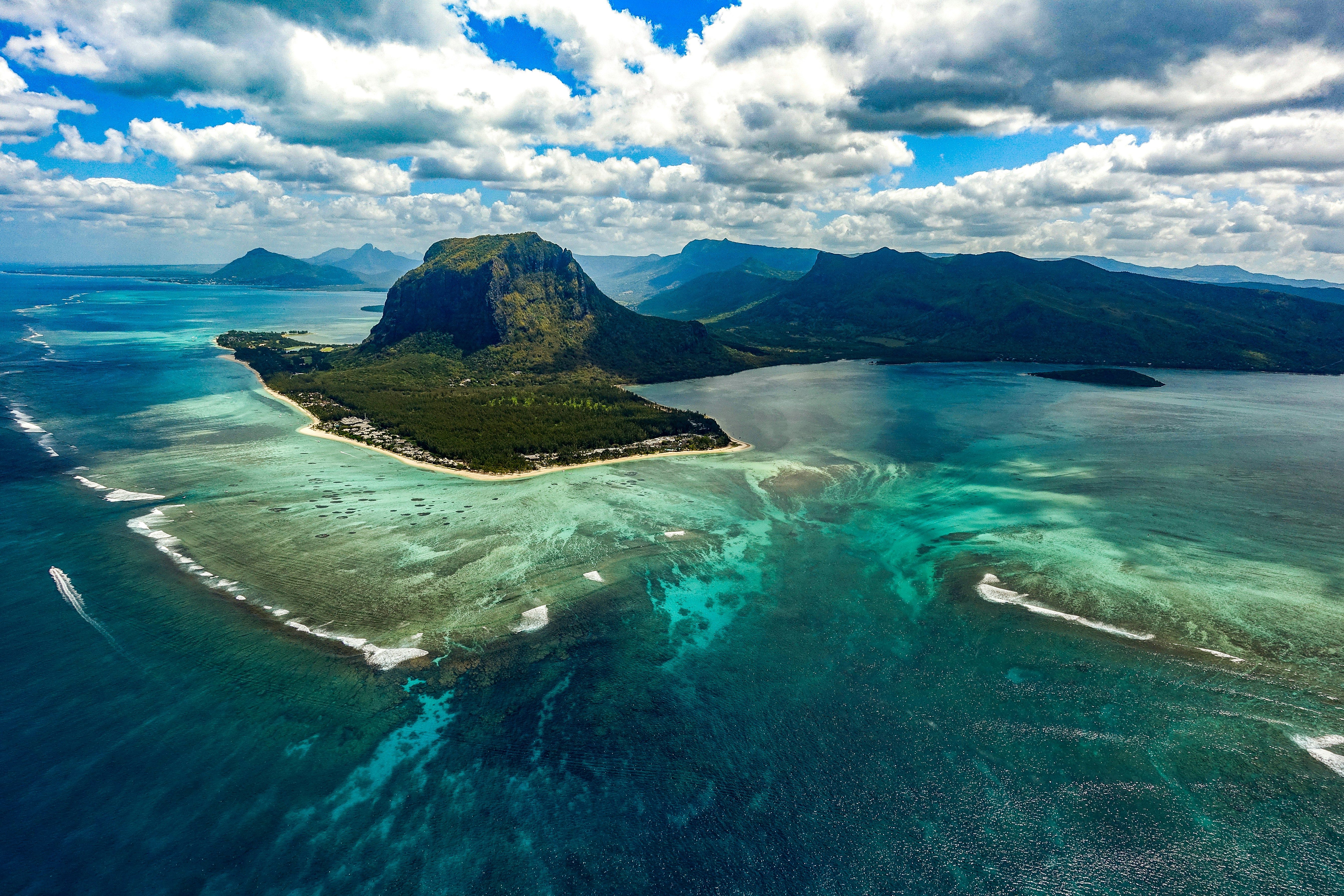 Sand falling off the coastal shelf creates the illusion of an underwater waterfall.