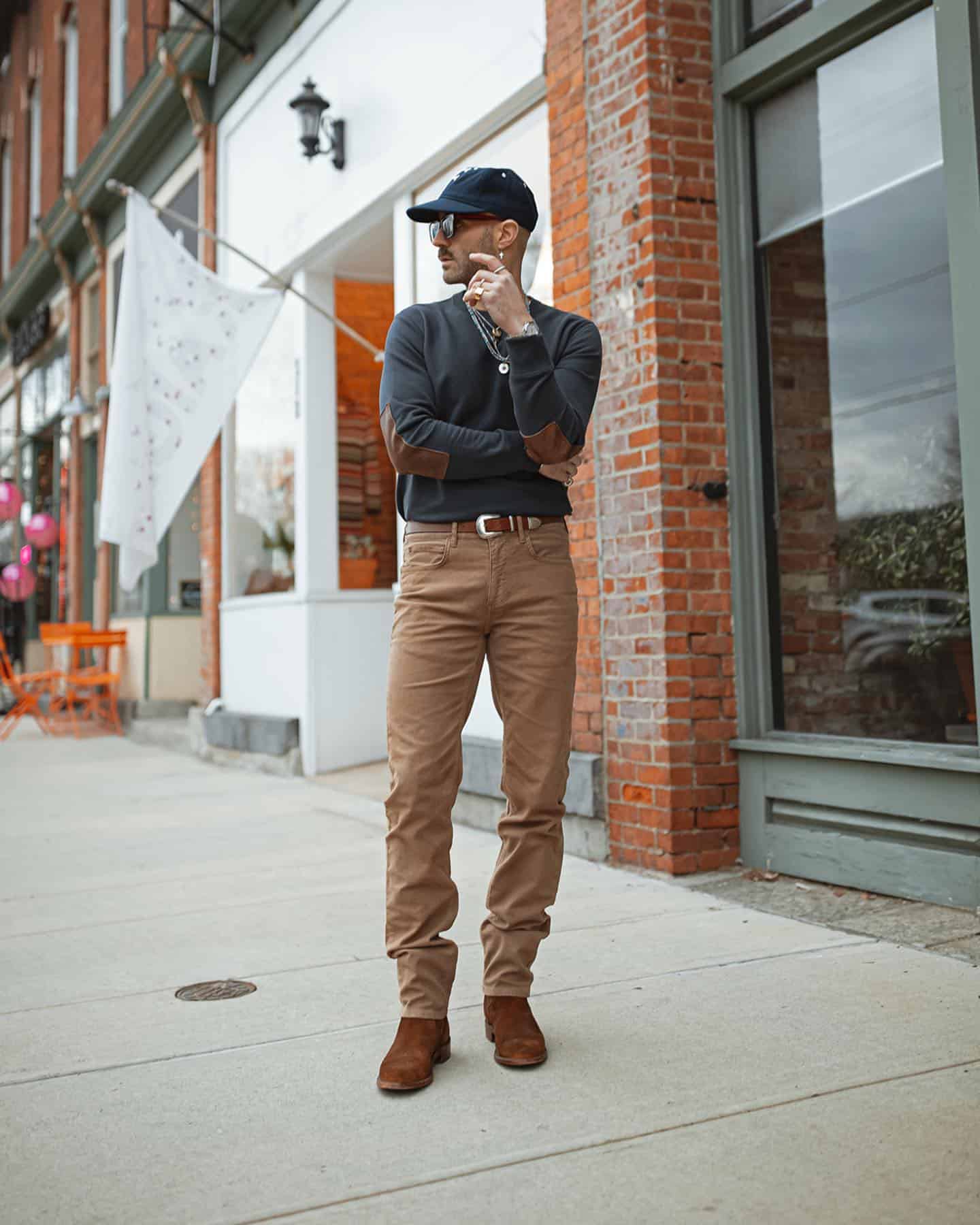 man wearing the Dover Leather Elbow Patch Sweatshirt by Billy Reid