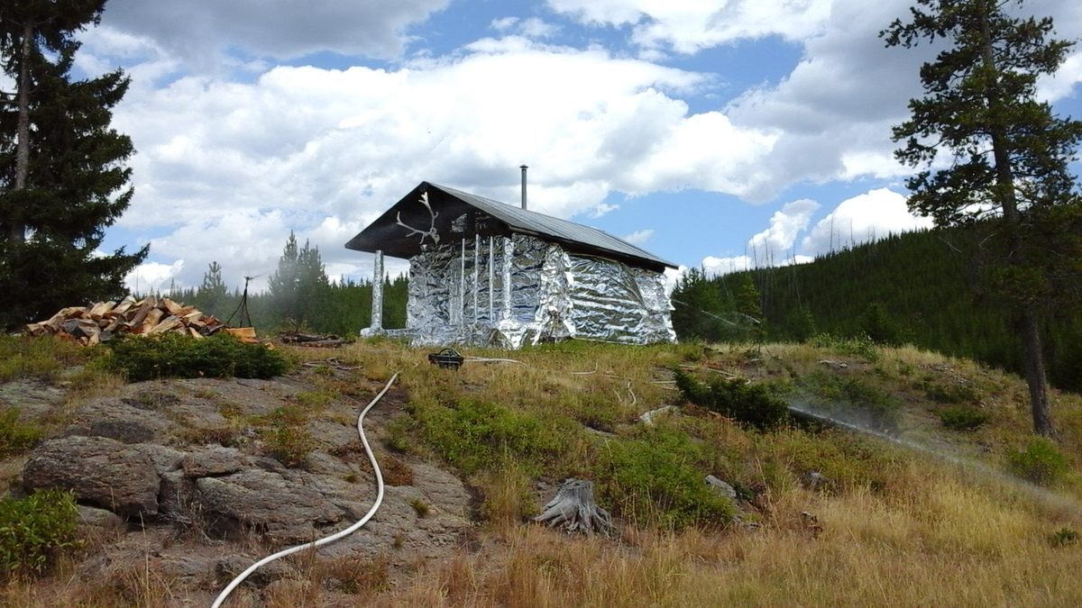 The Cougar Creek patrol cabin in Yellowstone National Park wrapped in fire-resistant aluminum before a fire in 2016.