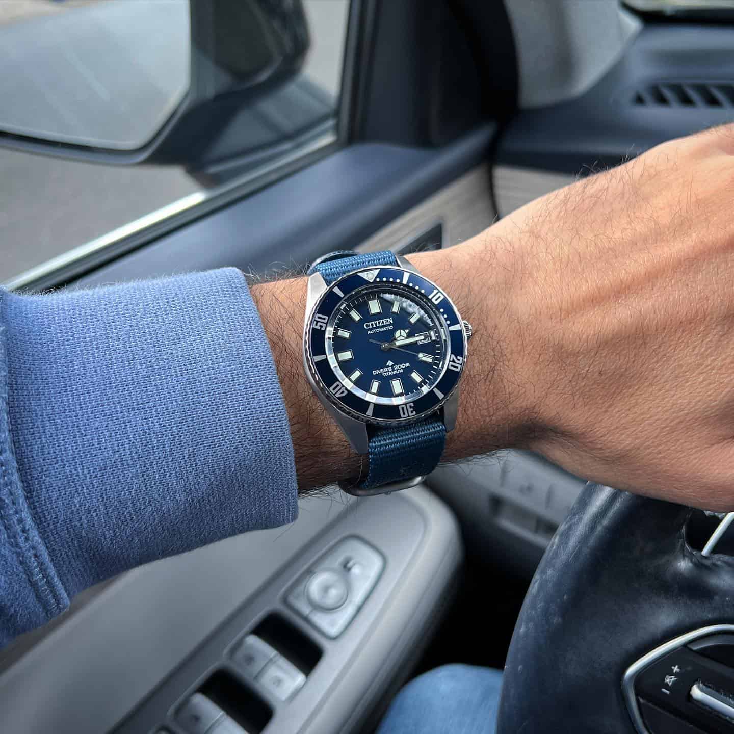 man wearing a dive watch by citizen