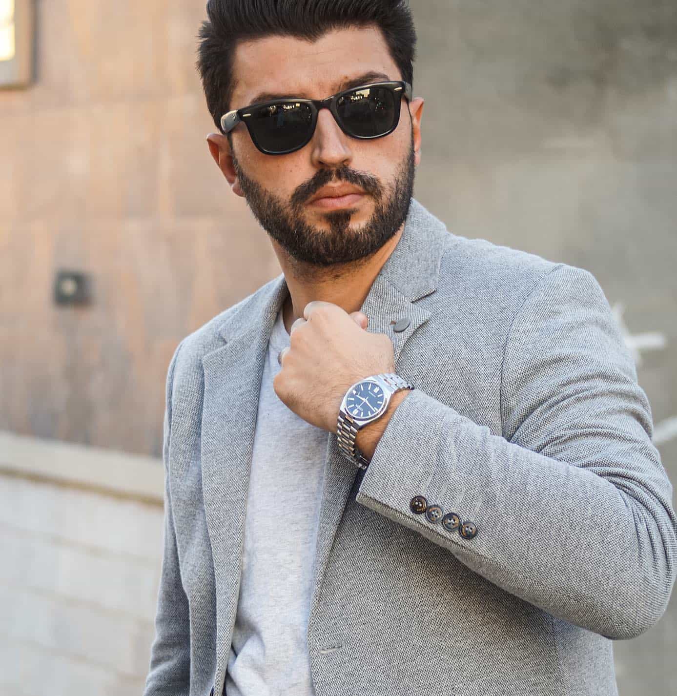 man wearing a black folding sunglasses