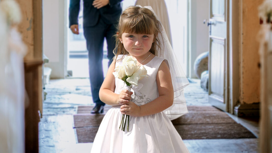 Completely-Charmless-Flower-Girl-Walks-Directly-Down-Aisle.jpg
