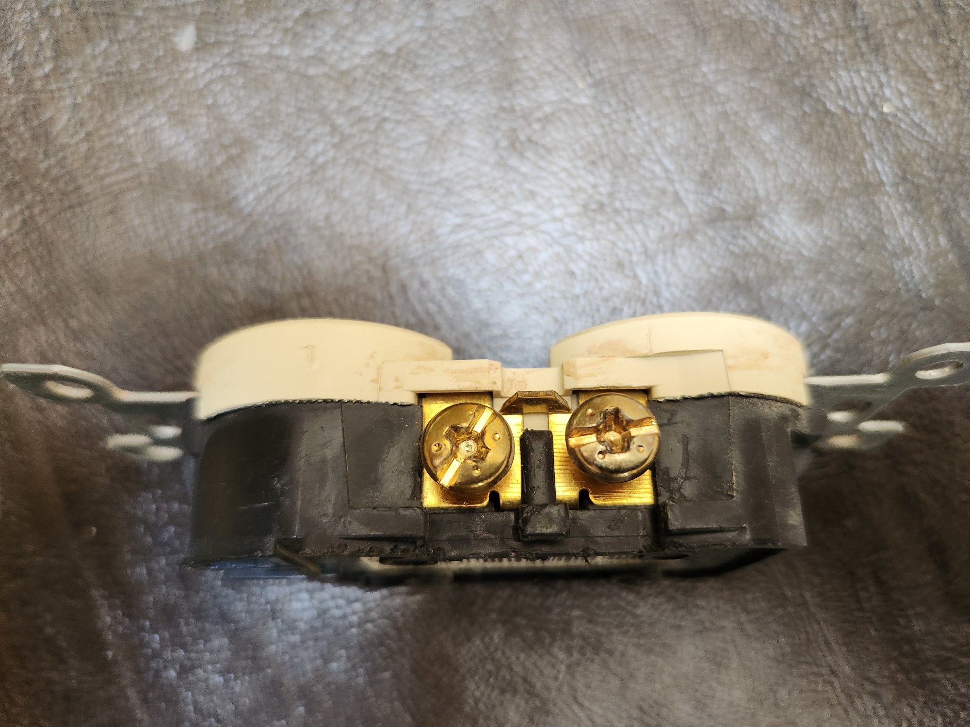 Outlet showing gold (hot) connection.
